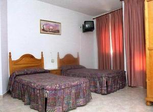 Cama o camas de una habitación en Hotel Limas