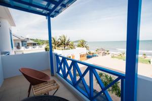 a balcony with a view of the beach at Sichon sunrise beach villa in Ban Plai Thon