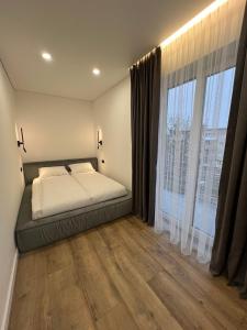 Postel nebo postele na pokoji v ubytování Modern apartament