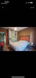 Ένα ή περισσότερα κρεβάτια σε δωμάτιο στο Appartement T2 dans une résidence avec une place de parking privée gratuite