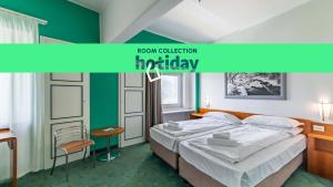 Postel nebo postele na pokoji v ubytování HOTIDAY Room Collection - Sauze Torre
