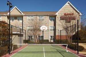 a tennis court in front of a building at Residence Inn Greenville-Spartanburg Airport in Greenville