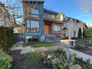 a house with a mailbox in the front yard at Fancy Family Suite with Parking near UBC in Vancouver