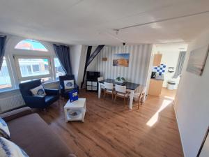 an aerial view of a living room and dining room at Appartementen Zandvoort in Zandvoort