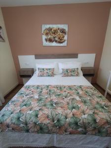 En eller flere senge i et værelse på Villa Santamaría