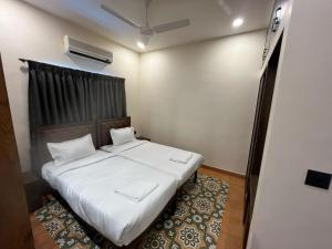Postel nebo postele na pokoji v ubytování Hotel Lotus