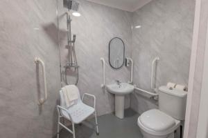 a bathroom with a sink and a toilet and a mirror at Best Western Ebbw Vale in Ebbw Vale +122 photos