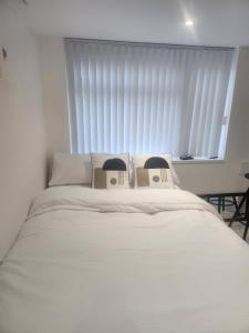 Voodi või voodid majutusasutuse Blue Moon Ensuite toas