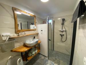 a bathroom with a sink and a shower at Princess Mojca Holiday House in Bled +60 photos