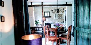 a kitchen and dining room with a table and chairs at Villa Victoria in Gradac