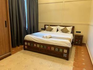Postel nebo postele na pokoji v ubytování Hotel Lotus