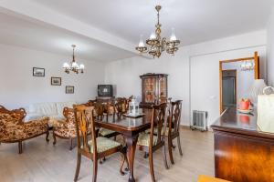 a dining room with a table and chairs at Casa de Rio Maior T3 in Rio Maior