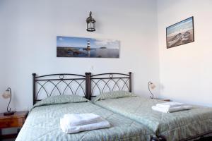 Postel nebo postele na pokoji v ubytování Delfini Hotel