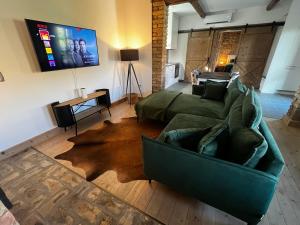 TV a/nebo společenská místnost v ubytování Singer Vendégház