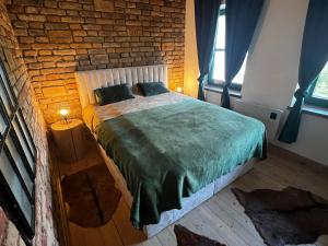 Postel nebo postele na pokoji v ubytování Singer Vendégház