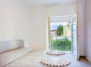 a bedroom with a bed with two pillows on it at Appartamenti Pamar in Civitanova Marche