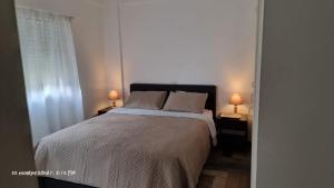 En eller flere senge i et værelse på Deana beach