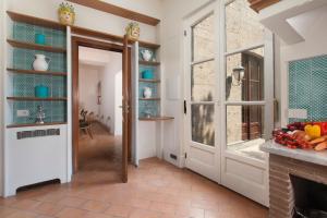 A kitchen or kitchenette at Relais Villa Russo