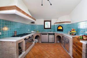 A kitchen or kitchenette at Relais Villa Russo