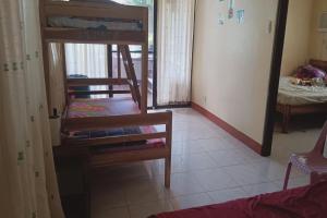Postel nebo postele na pokoji v ubytování Larosa Hostel Puerto Princesa