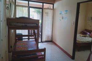 Postel nebo postele na pokoji v ubytování Larosa Hostel Puerto Princesa