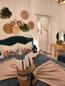 a bedroom with a bed with a basket on it at Mana mia Seaside Apartments in Leptokaria