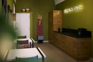 a room with a kitchen with a counter and a sink at B&B Casa Ninè in Gioia del Colle