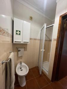 a bathroom with a toilet and a shower at Casa São Salvador in Angra do Heroísmo +23 photos