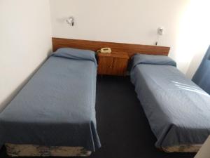 Postel nebo postele na pokoji v ubytování Residencial Ski