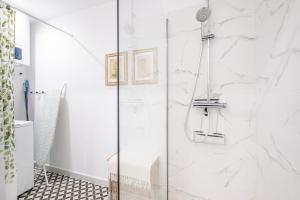 a shower with a glass door in a bathroom at Casa Brisa in Altea +25 photos