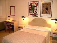 Postel nebo postele na pokoji v ubytování Hotel Armando' s