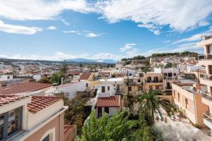 a view of the city from the roofs of buildings at Barbara Studios in Rethymno