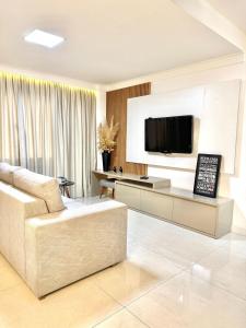 Televisyen dan/atau pusat hiburan di Área Gourmet, wi-fi e conforto