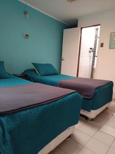 Hostal Caleta Abarca客房内的一张或多张床位