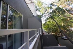 a balcony of a house with a view of a street at Element Hotel in Medellín