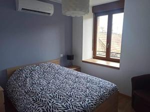 Ένα ή περισσότερα κρεβάτια σε δωμάτιο στο Gîte de la Barbèche