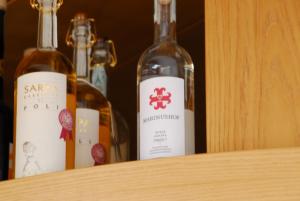 three bottles of wine sitting on a shelf at Hotel Dolomiten in Collalbo