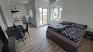Posteľ alebo postele v izbe v ubytovaní Apartmán u letiště