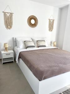 Ένα ή περισσότερα κρεβάτια σε δωμάτιο στο Viento Suites Possidi