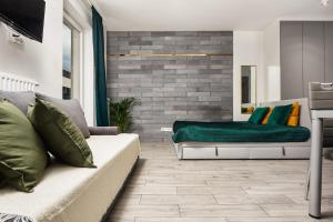 Część wypoczynkowa w obiekcie Lumina cozy apartments Manufaktura