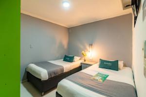 Cama o camas de una habitación en Hotel Elegant Suite
