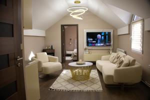 TV a/nebo společenská místnost v ubytování Central Lux Apartman Spa