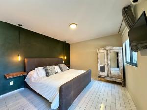 Postel nebo postele na pokoji v ubytování Casa Bakora Hotel