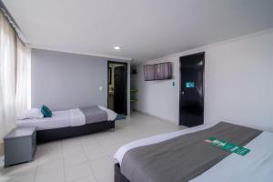 Cama o camas de una habitación en Hotel Elegant Suite