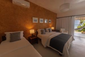 Katil atau katil-katil dalam bilik di Hotel Maitei