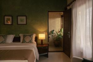Katil atau katil-katil dalam bilik di Hotel Maitei