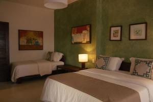 Katil atau katil-katil dalam bilik di Hotel Maitei