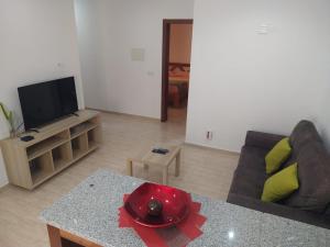 TV a/nebo společenská místnost v ubytování Ladeira apartamentos