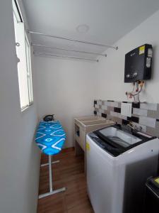 a small kitchen with a sink and a stove at Apartahotel JDK in Armenia +109 photos