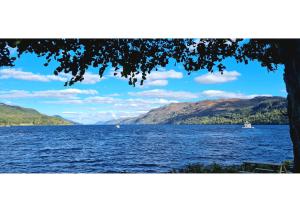 a view of a large body of water with mountains at The Old Stables in Fort Augustus